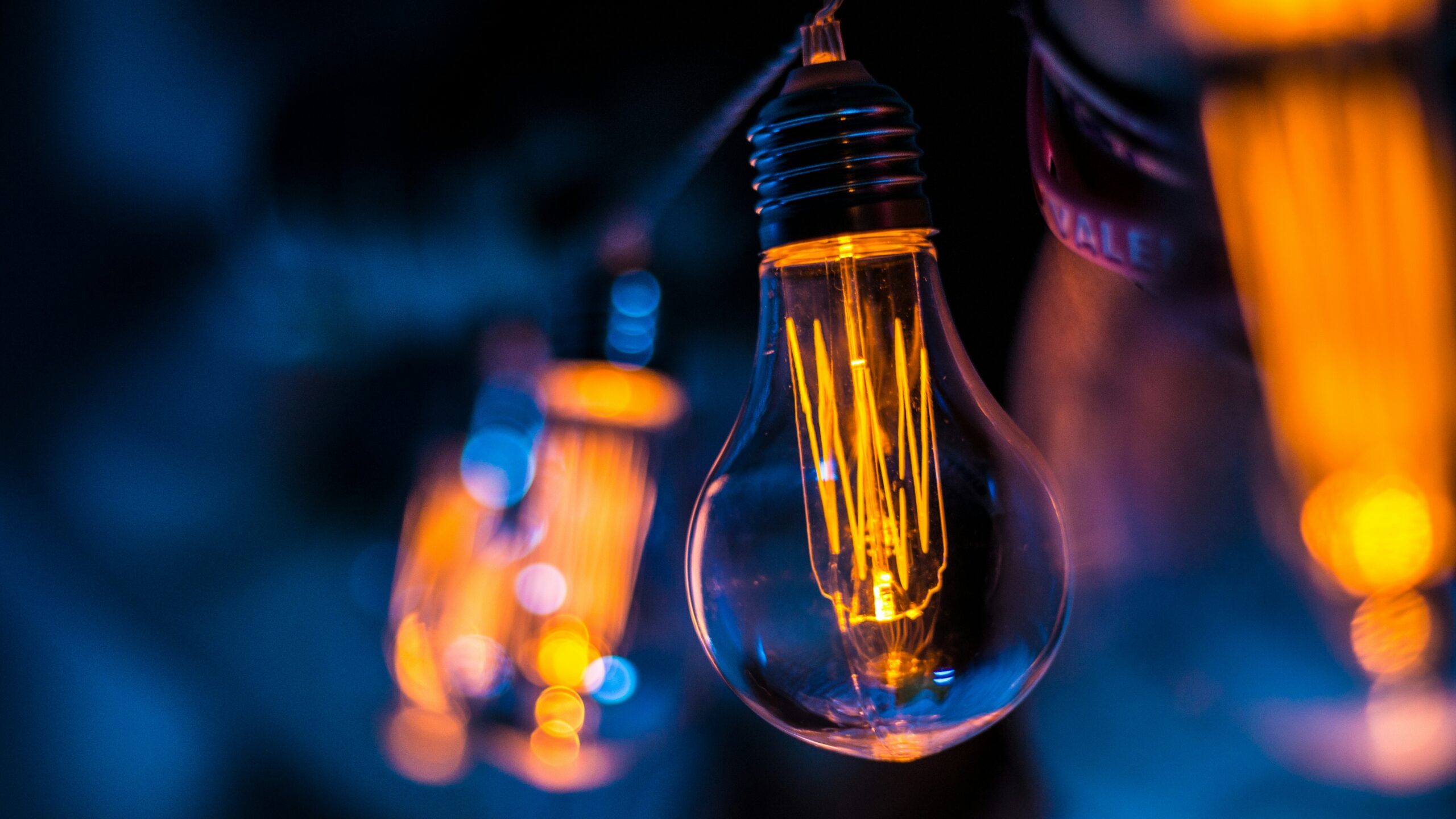 selective focus photography of clear lightbulb