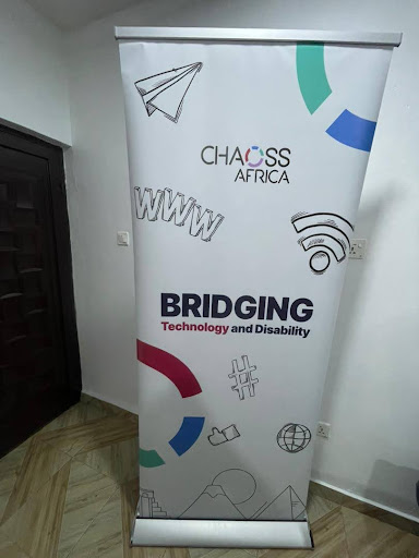 Standing banner display with the CHAOSS AFrica logo and words that say "Bridging Technology and Disability"